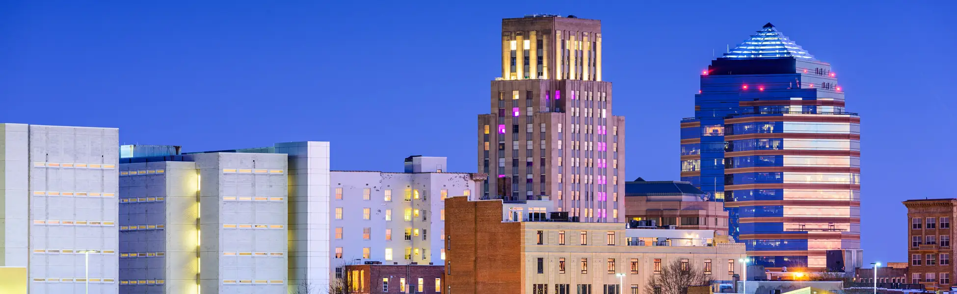 Neon color image of a band playing and people singing along
