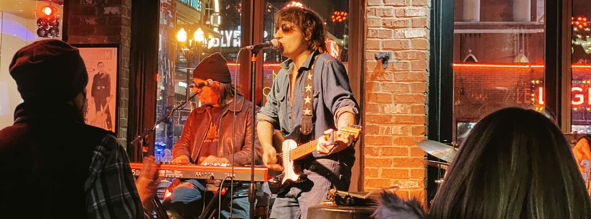 bar singer on guitar in Durham